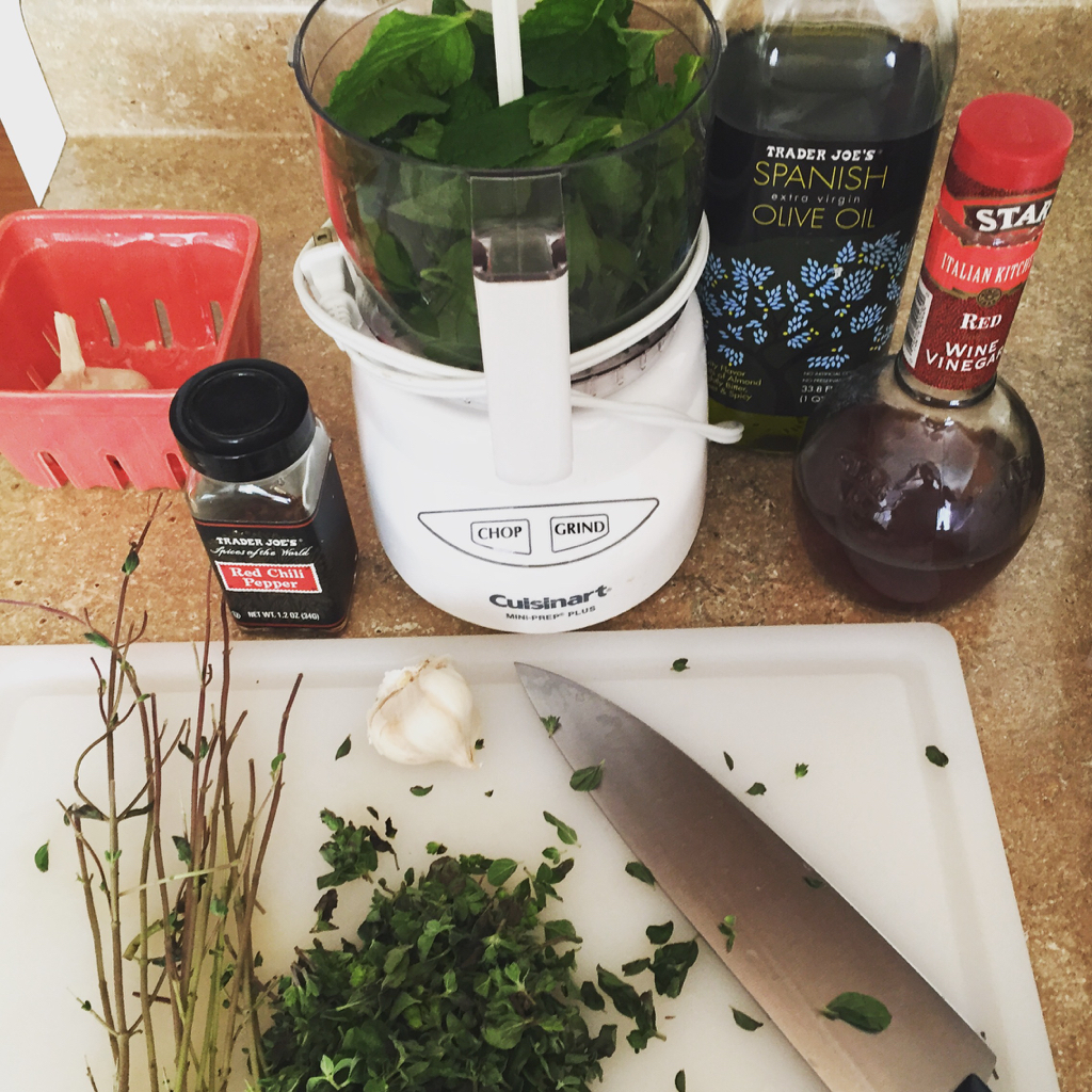 cooking with fresh herbs making chimichurri